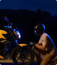 Close-up of the TVS Raider 125 2025 alloy wheels highlighting the red rims and front disc brake for better grip and control.