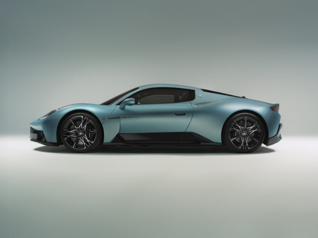 Side profile of Maserati MC20 Cielo Coupe displaying its sculpted body lines, butterfly doors, and low stance.