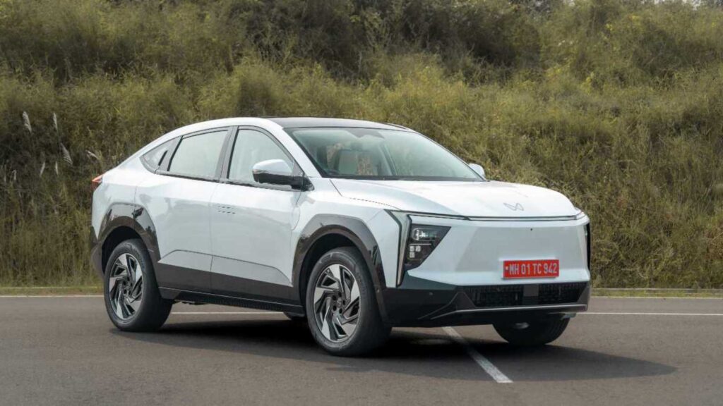 Side profile of Mahindra XEV 9S electric SUV showcasing its sleek design, smooth curves, and aerodynamic stance.